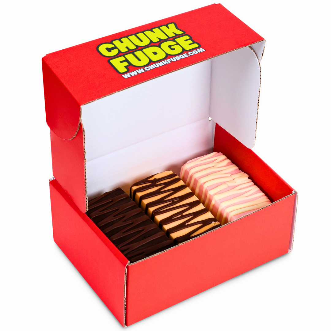 A red box labeled 3 Chunks Bundle Box contains rows of rectangular fudge in chocolate, caramel, and pink flavors, each topped with a zigzag chocolate drizzle.