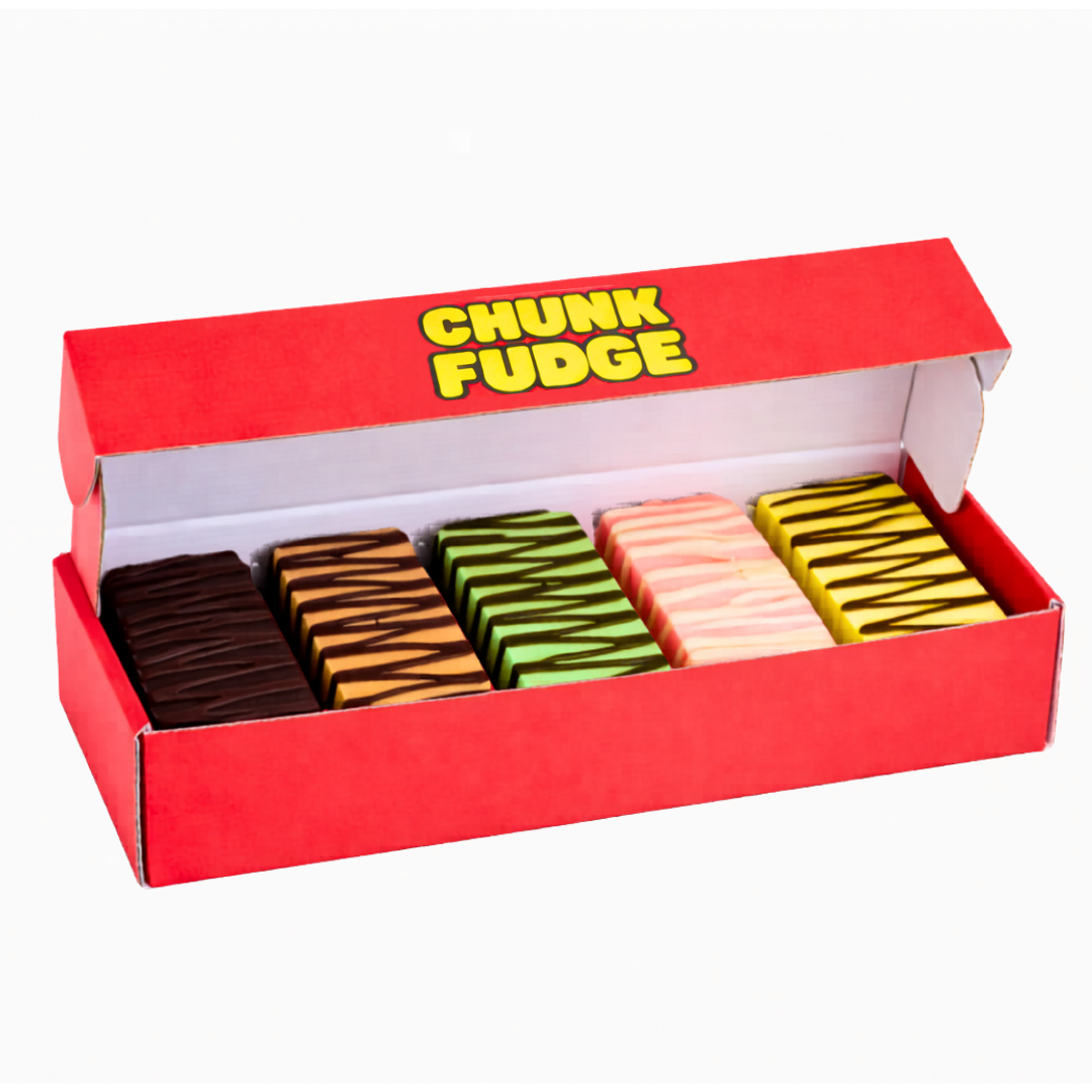 An open red 5 Chunks Bundle Box reveals four rows of colorful fudge pieces—chocolate, green, pink, and yellow—each topped with striped icing.