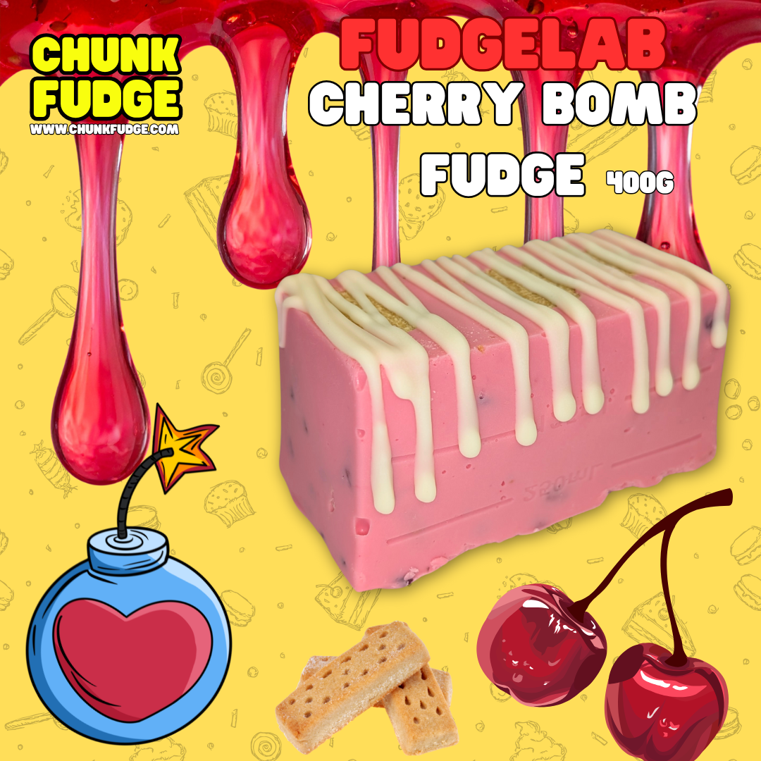 A pink cherry-flavored chunk of Cherry Bomb Fudge with white drizzle sits on yellow, surrounded by cherries, fudge pieces, a heart-bomb cartoon, and red fudge drizzle. Text: Cherry Bomb Fudge 400g.