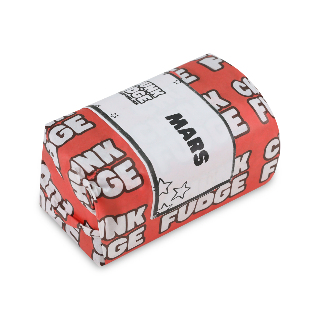 Wrapped Mars Fudge bar in red and white Chunk Fudge packaging