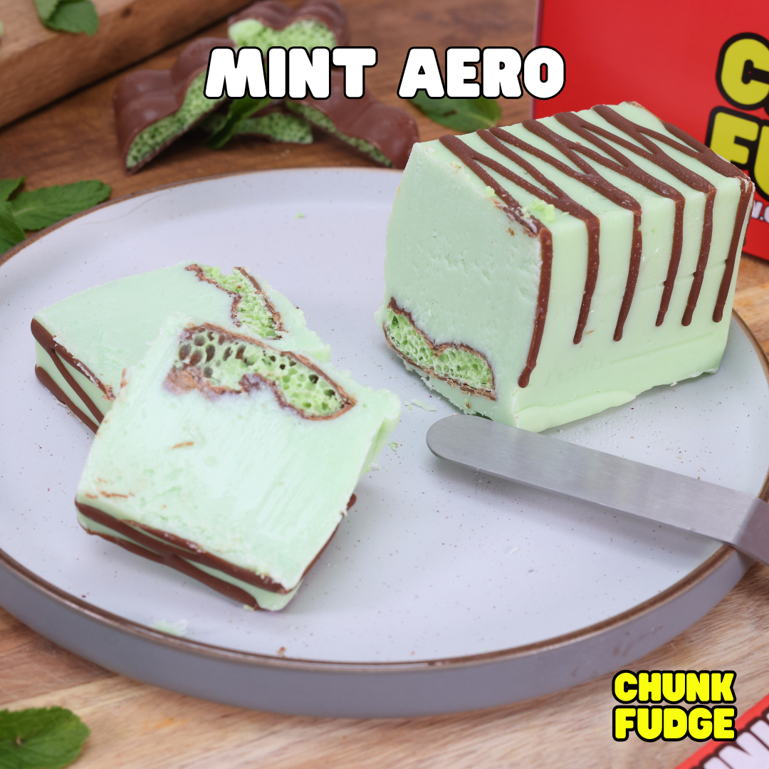A plate with sliced Mint Aero Fudge, showing chocolate layers and mint-green filling, sits beside a knife. A red Chunk Fudge box appears in the background. Text reads "MINT AERO" and "CHUNK FUDGE." UK delivery available.