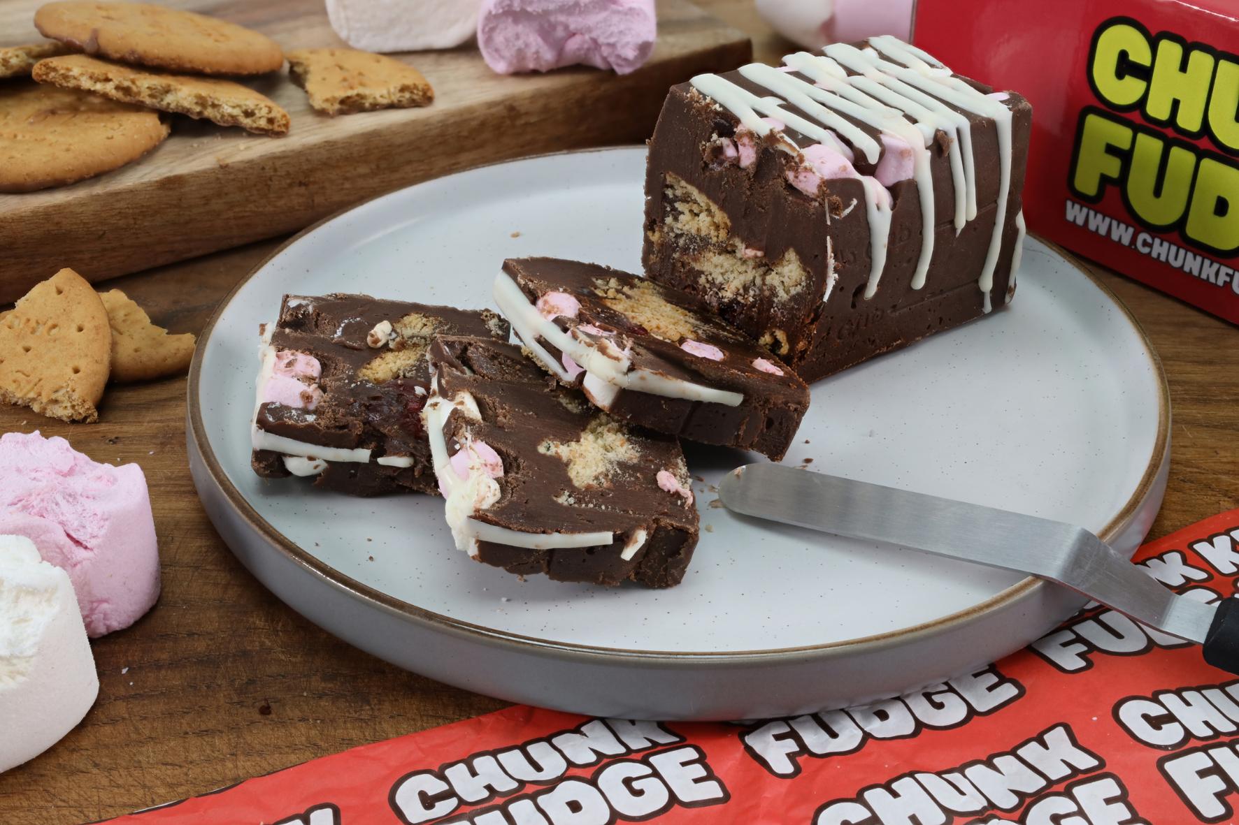 Landscape view of Rocky Road Fudge showing chocolate fudge, marshmallows, glacé cherries and biscuit