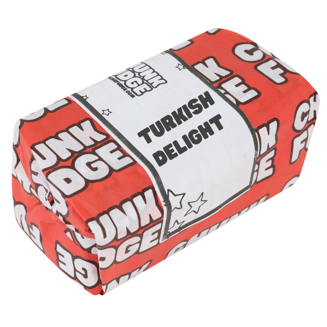 A rectangular block labeled Turkish Delight Fudge, wrapped in red and white with star designs and a white section reading TURKISH DELIGHT, offers a classic rose-flavoured fudge experience.